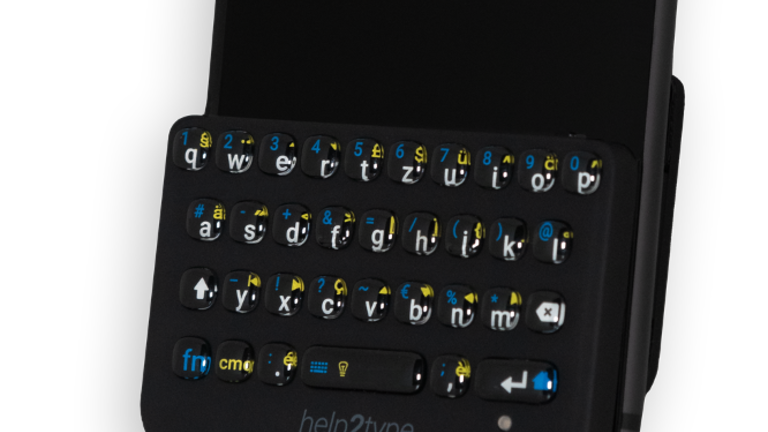 Die haptische Tastatur von help2type an einem Smartphone angebracht | © help2type