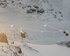 Die Kabinen einer Seilbahn über den schneebedeckten Felswänden. | © SBB CFF FFS